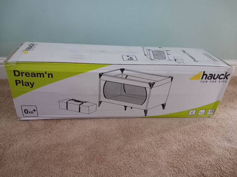 New Hauck multi coloured travel cot.  Box unopened.  Buyer to collect. 