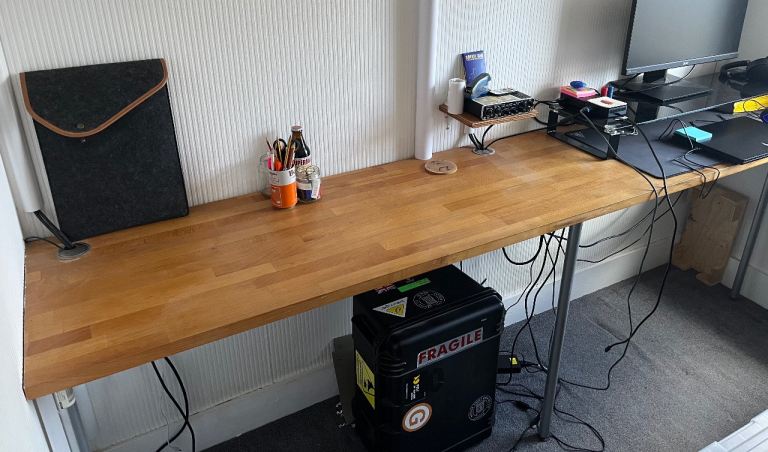Wooden desk/table with legs.
