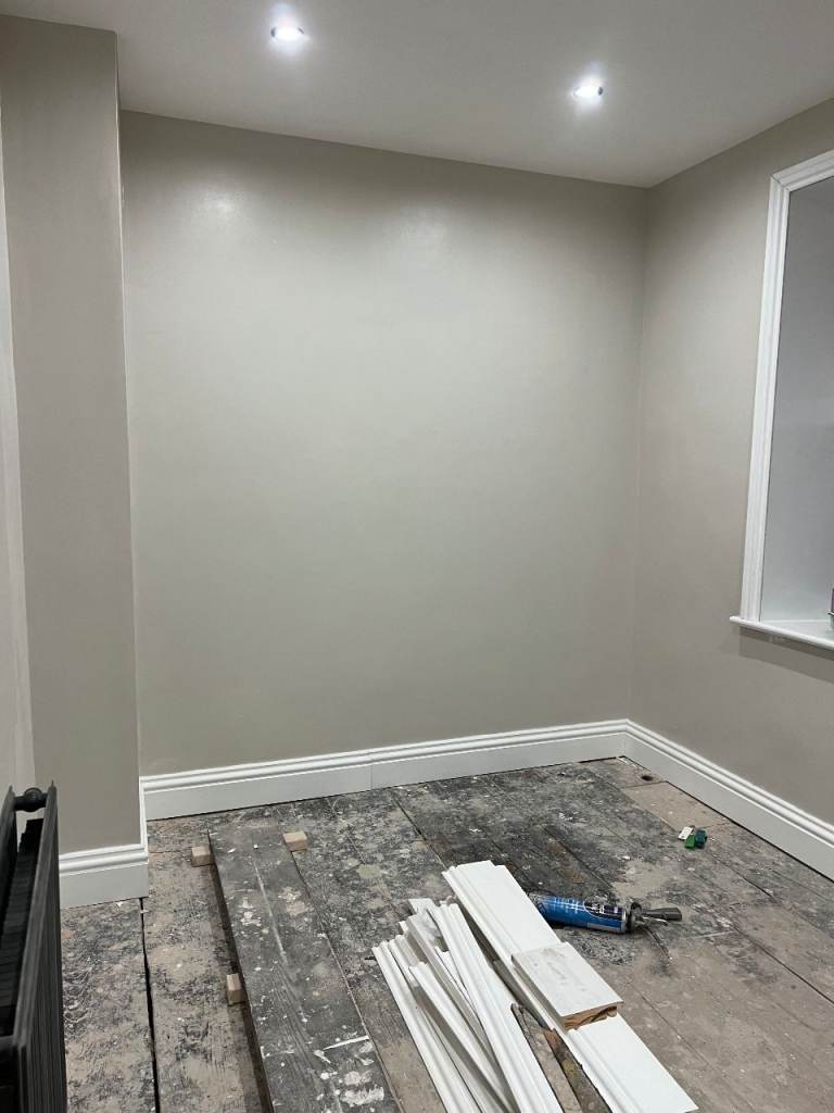 Painting Plastering boarding out walls 