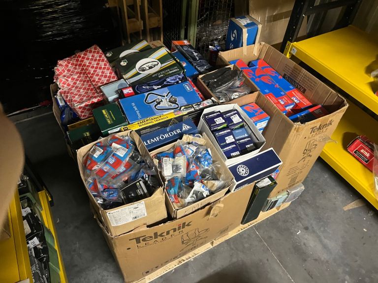 Clearance of NOS (New Old Stock) auto parts across 4 wrapped pallets. 1,000+ pieces total.