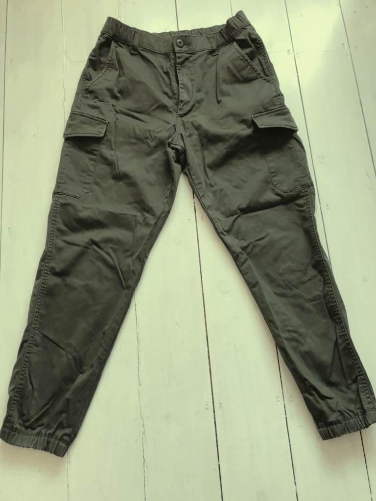 Boy's olive cargo trousers age 8. Waist 27 - 30 inch adjustable. Length 37 inch inside leg 27 inch