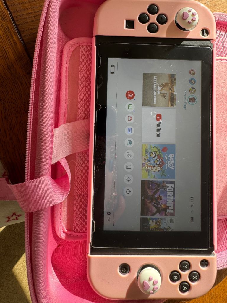 Nintendo Switch with 4 Games, Pink Case & Accessories