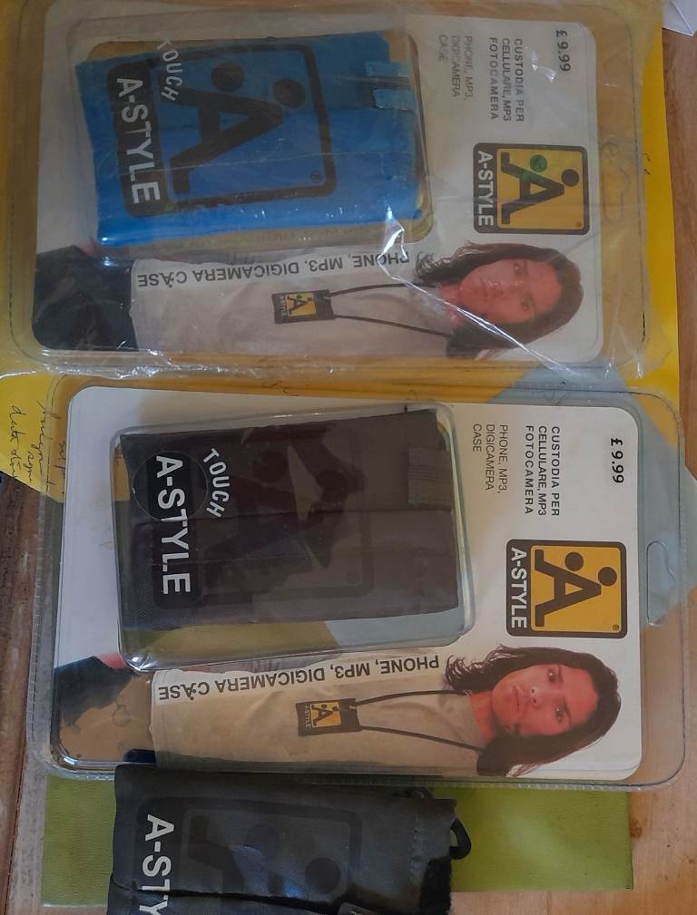 new 1/2 price phone, mp3, digicam case still packaged