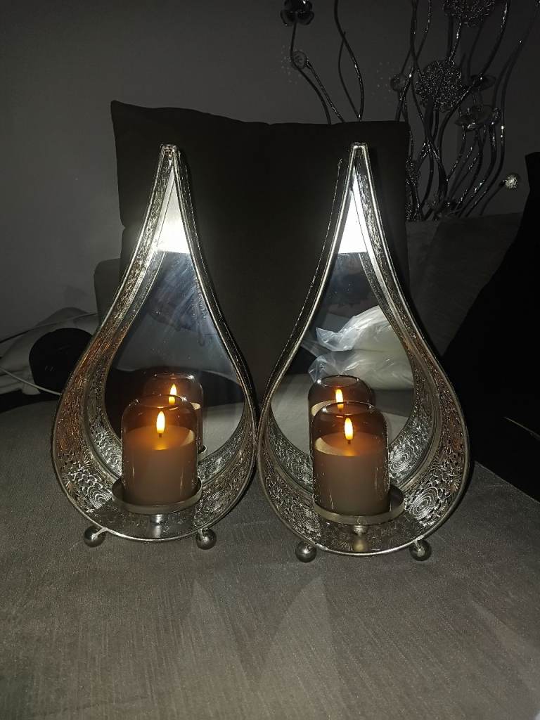 2 xbrand new silver Moroccan mirrored candle stands with battery operated candles 