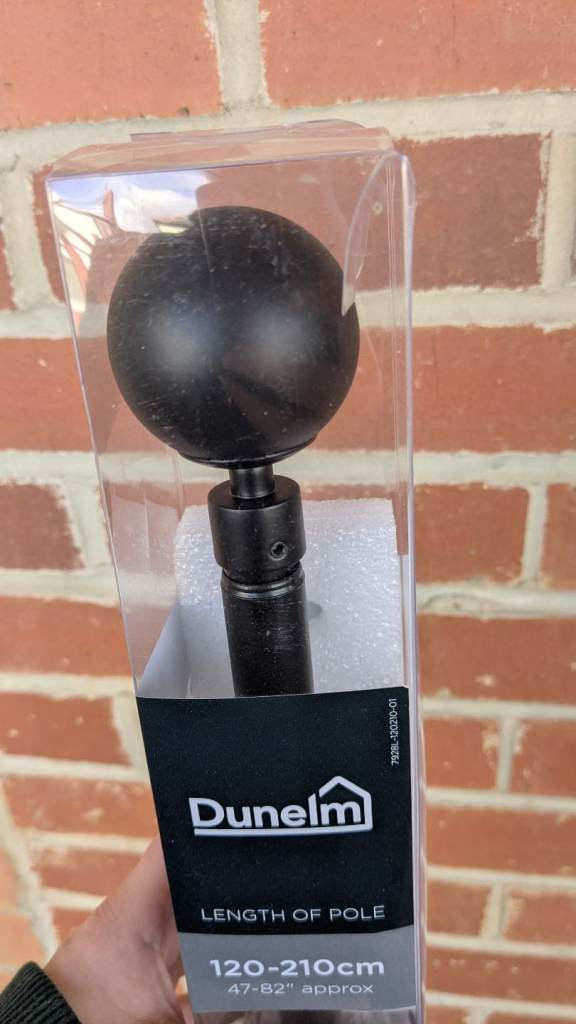 Black Dunelm curtain pole
