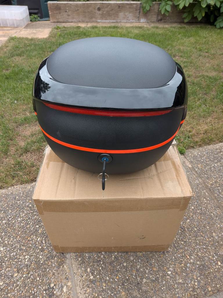 Brand new unbranded motorcycle top box with mounting fittings and key