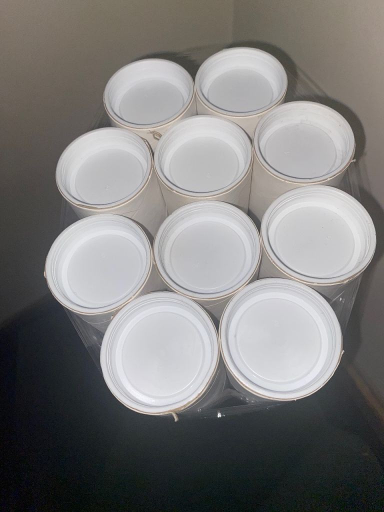 A Bundle of 10 White Cardboard Postal Tubes