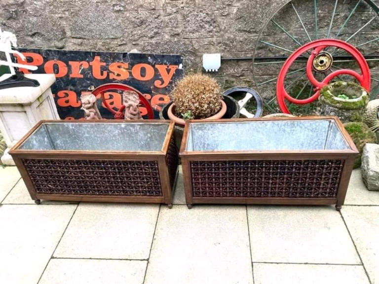 Large Wooden Planter Troughs Circa 1960’s. Decorative wooden side panels set on turned feet.