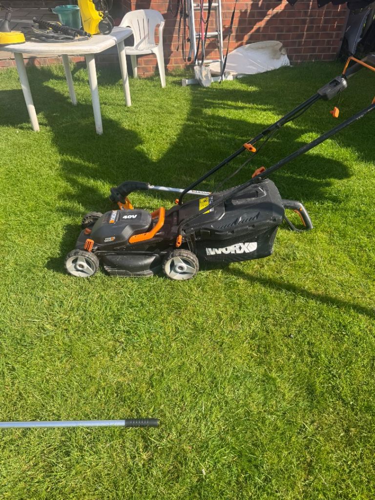 Worx battery lawnmower and strimmer 