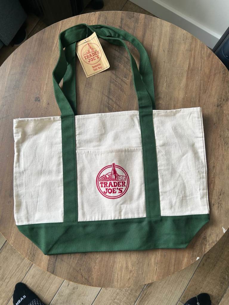Trader Joe's Iconic tote bag with Dark Green straps.  New with tags