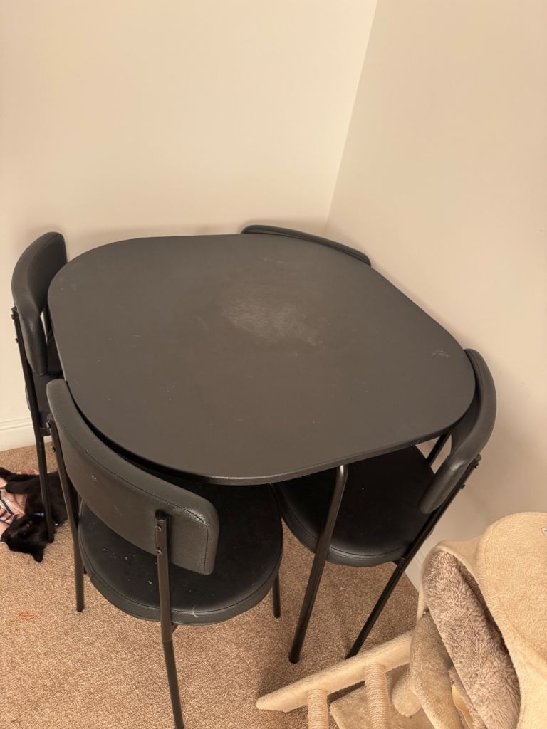 Compact black Dining Table and 4 Chairs – Fair Condition