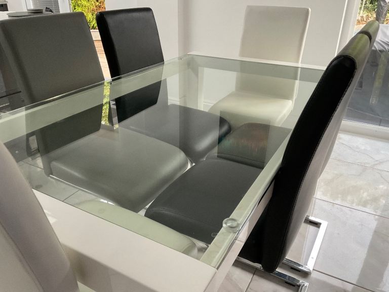 Glass Top Dining Table with White Base and 6 Chairs – Good Condition