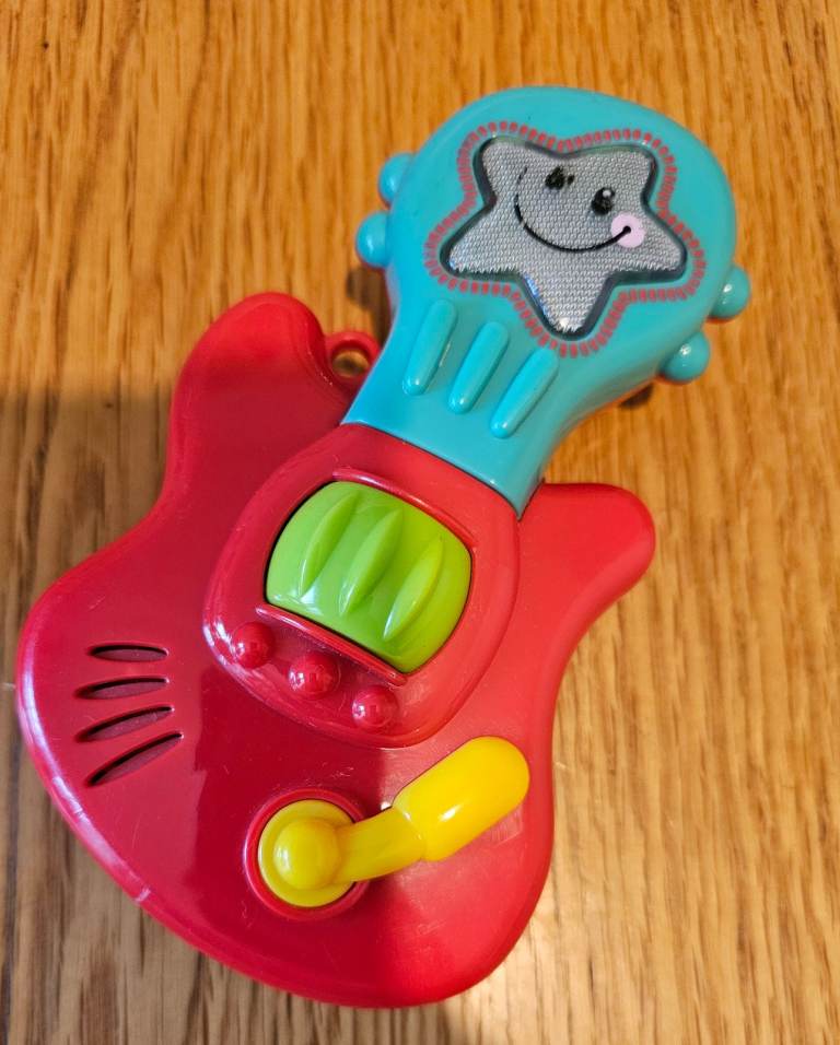 Used musical guitar toy