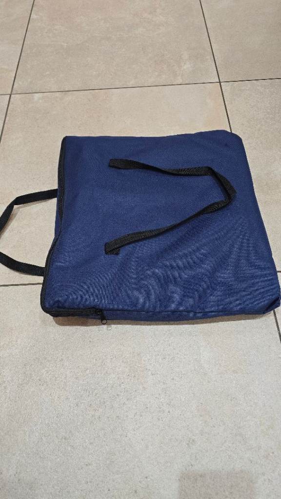 Blue soft-sided pet carrier with shoulder strap