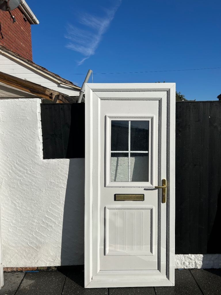 White UPVC Front Door with Glass Panel and Brass Hardware