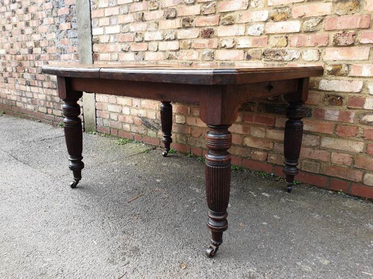Antique Victorian Solid Oak Dining Table On Castor Wheels