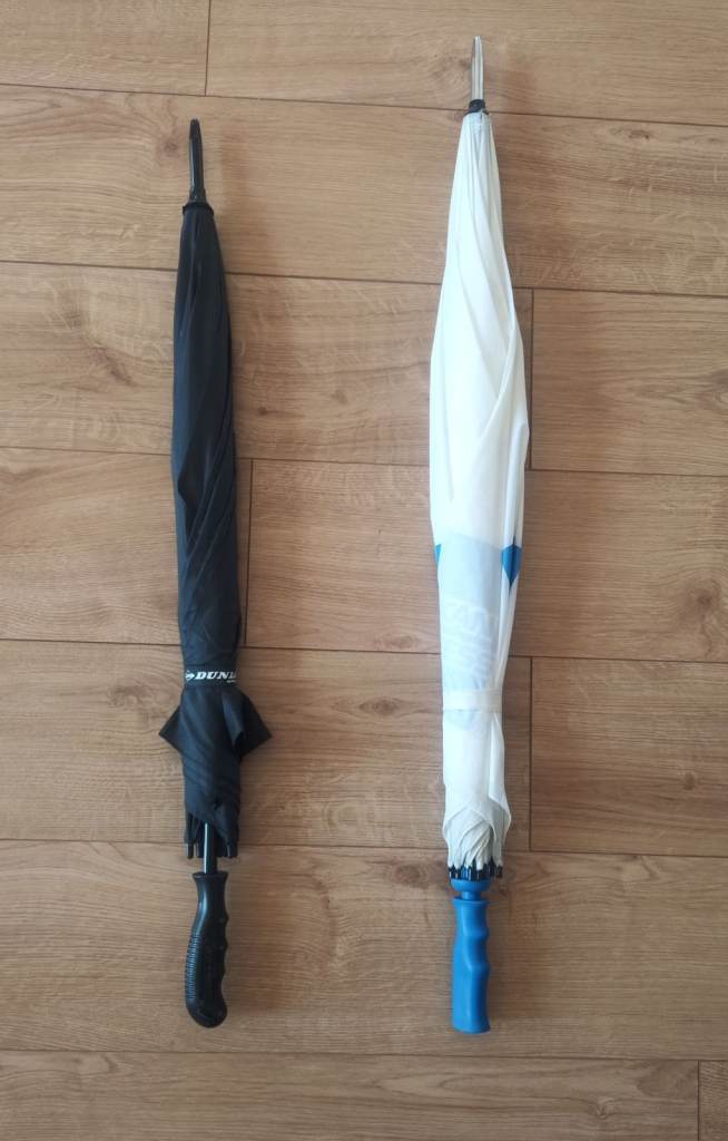 Two large golf umbrellas