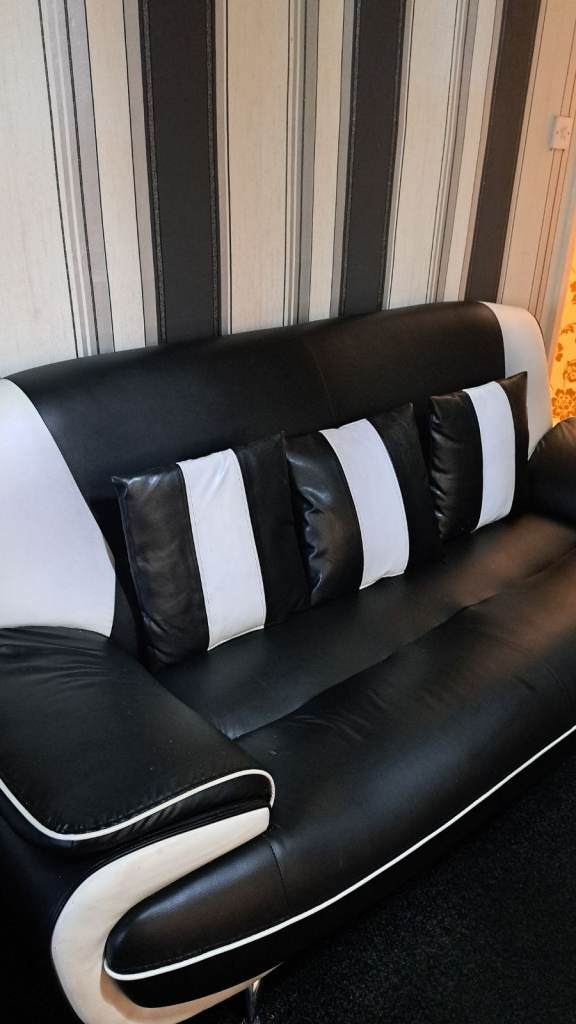 Two black and white leather sofas 