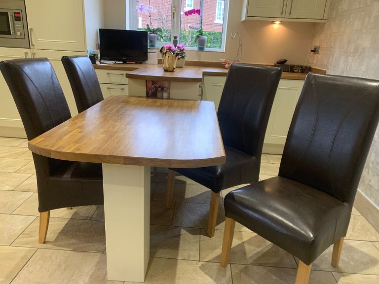 4 quality faux leather dining chairs