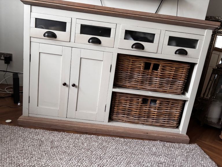 Wooden side board with baskets draws and cupboards 