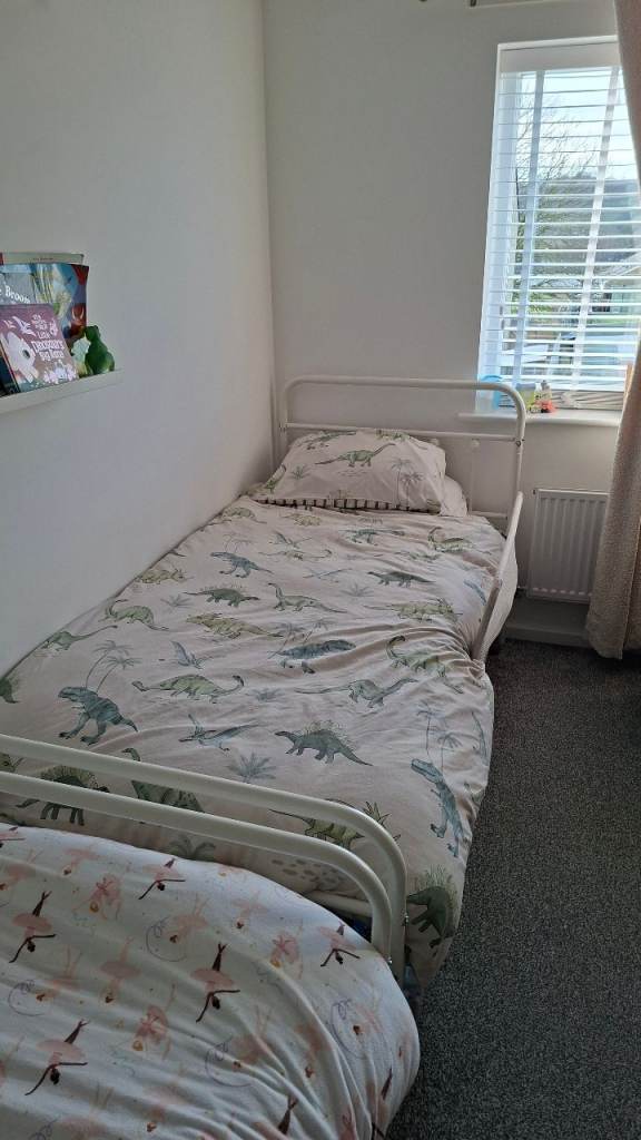 2x single white metal beds