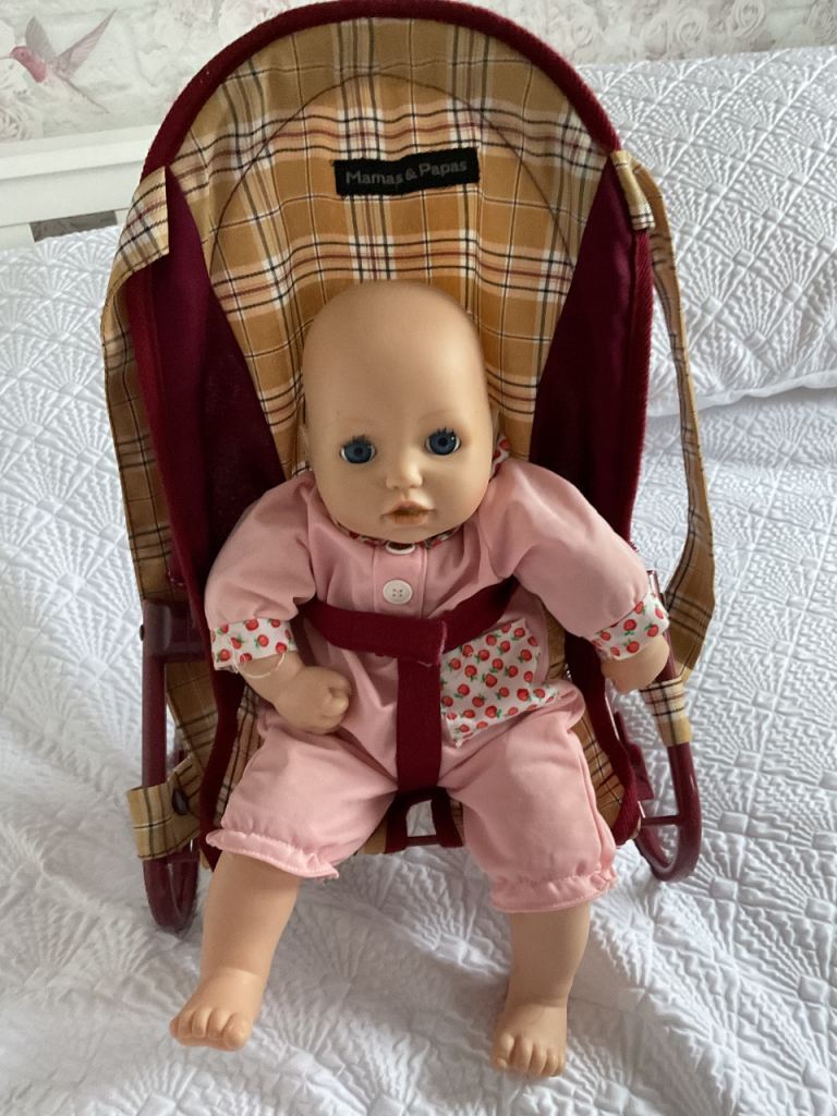 Mamas and papas carrier with baby