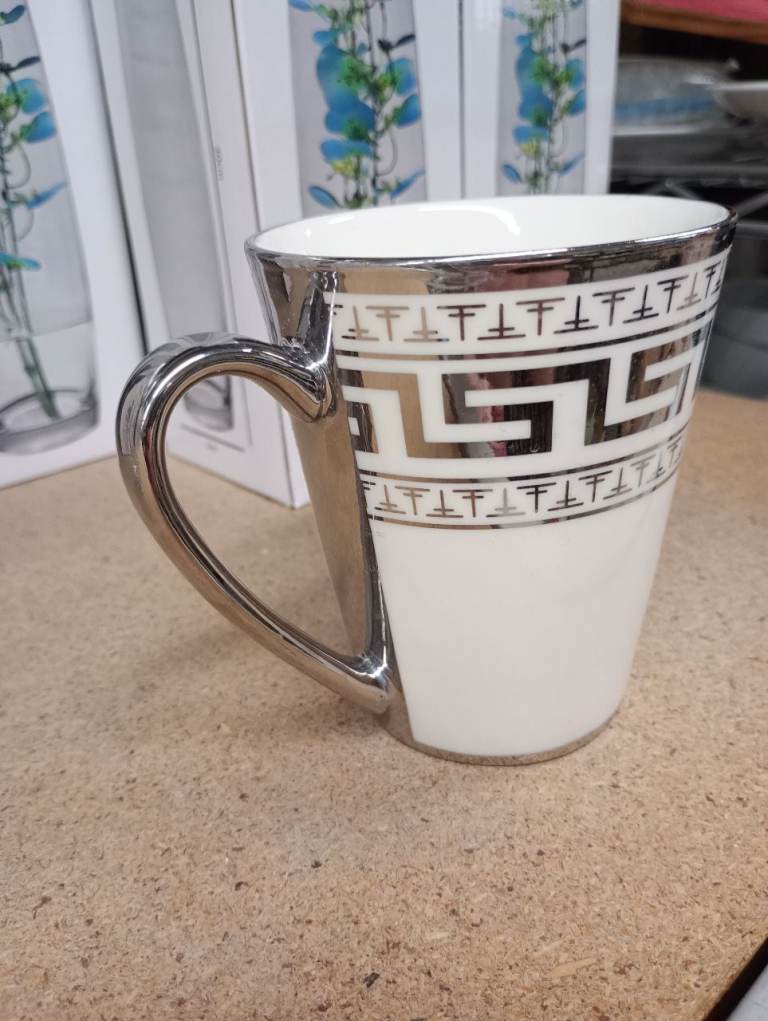 Beautiful silver and white colour mugs