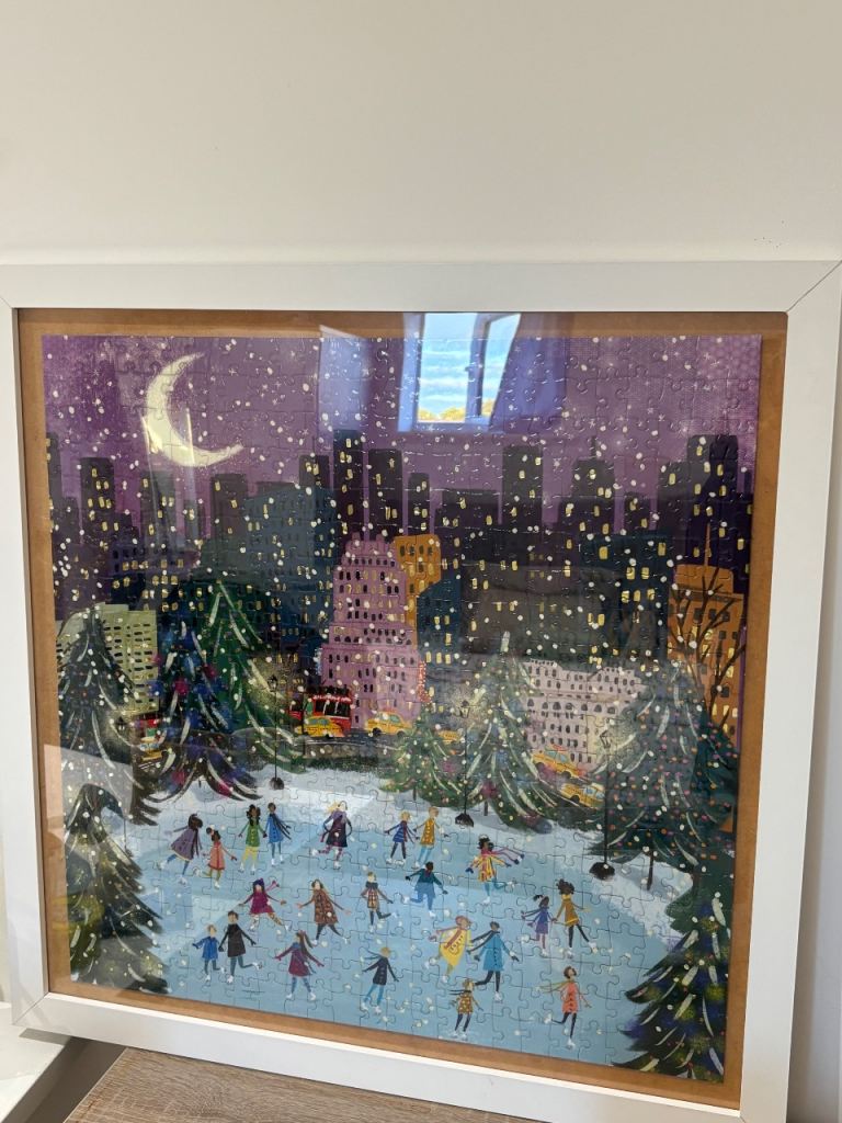 Framed Completed Jigsaw Puzzle | 55cm x 55cm, Winter City Ice Skating Scene