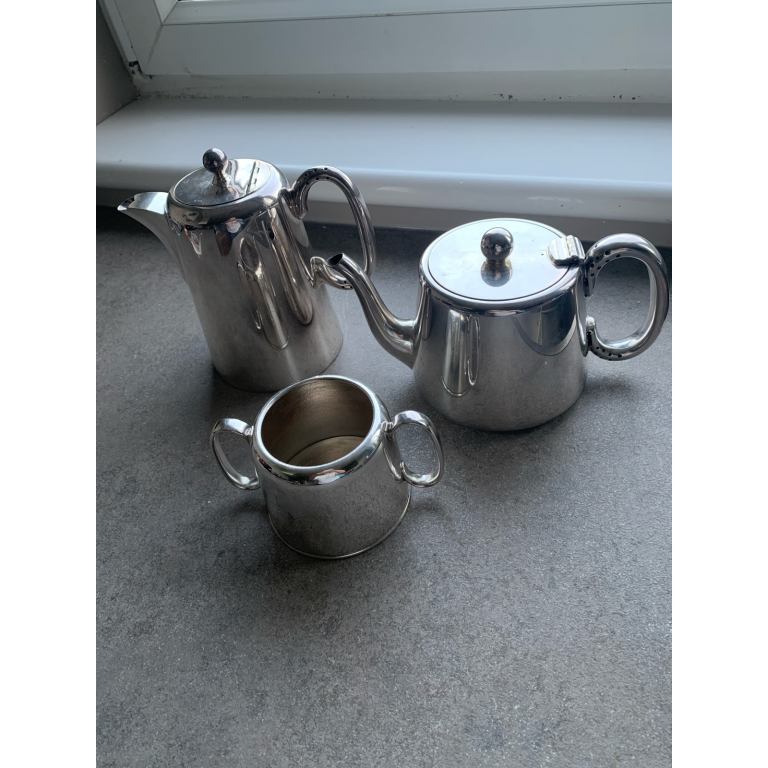 Silver tea and coffee pots and sugar bowl. 