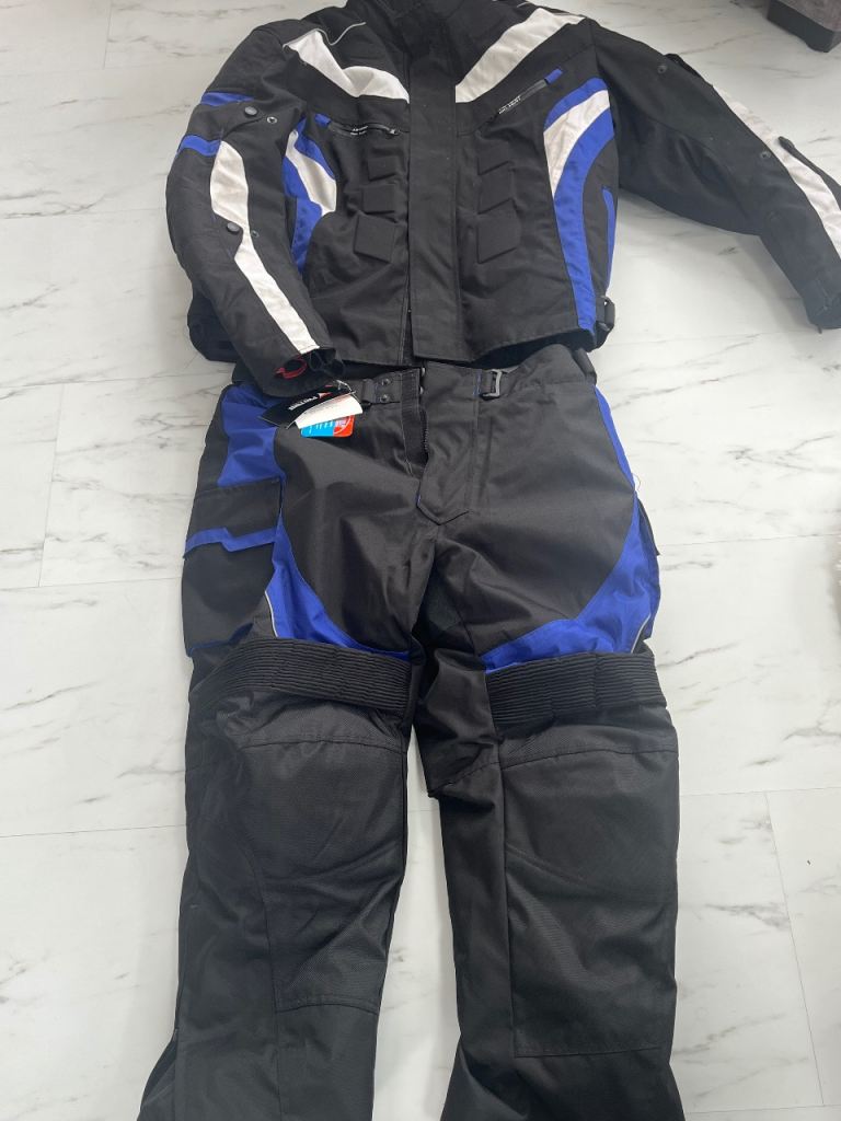 Motorbike suit and extra trousers