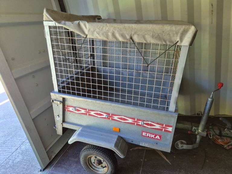 Car trailer with caged sides and jockey wheel