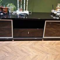 Large black gloss TV/sideboard unit.  2 sliding doors and 2 draws. 