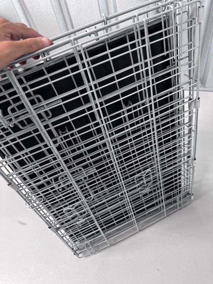 Small folding metal dog crate / cage in excellent (like new) condition.