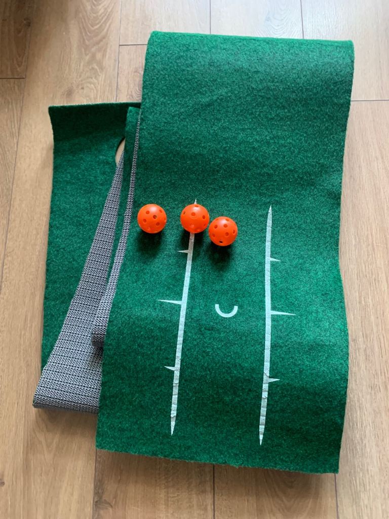 Golf putting mat and practice balls. 