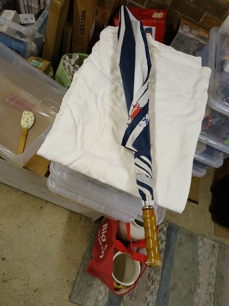 Extra large umbrella with wooden handle, good condition.