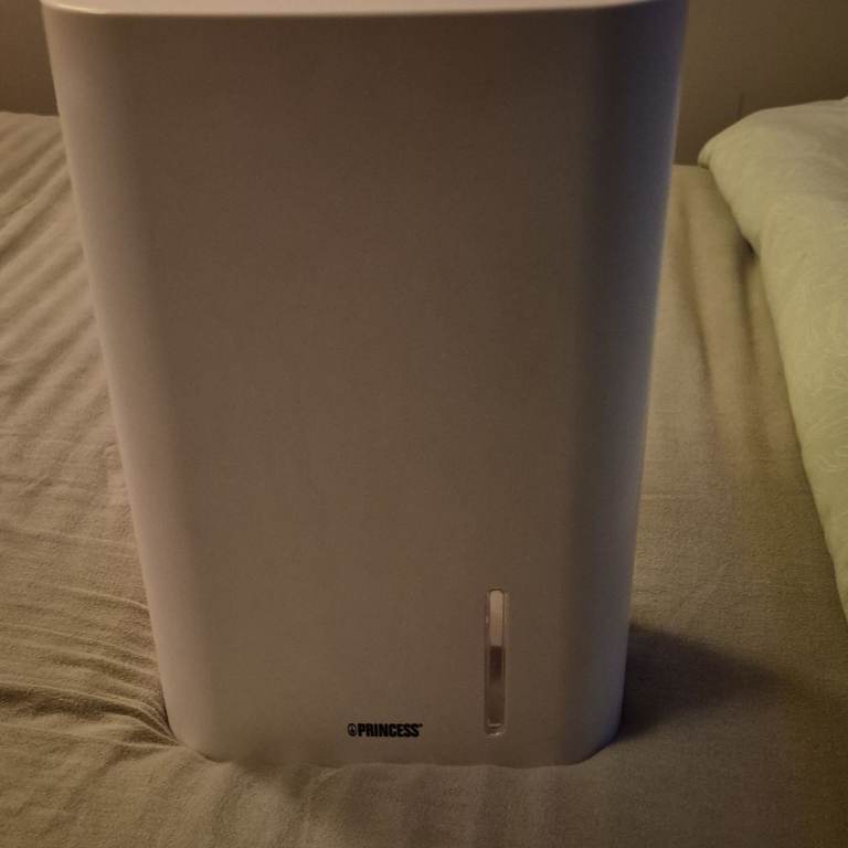 Free standing mini dehumidifier