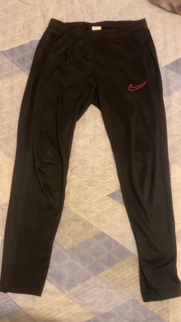 Nike Dri Fit Size M black and with red Nike tick