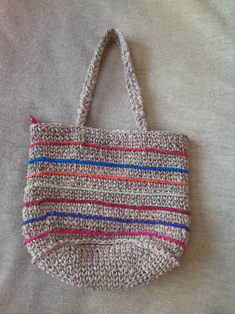 New, beautiful, handcrafted bag made of strong, organic grass.