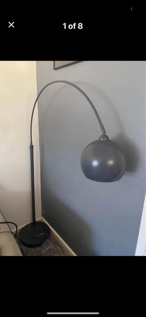 Designer Heals arc floor light