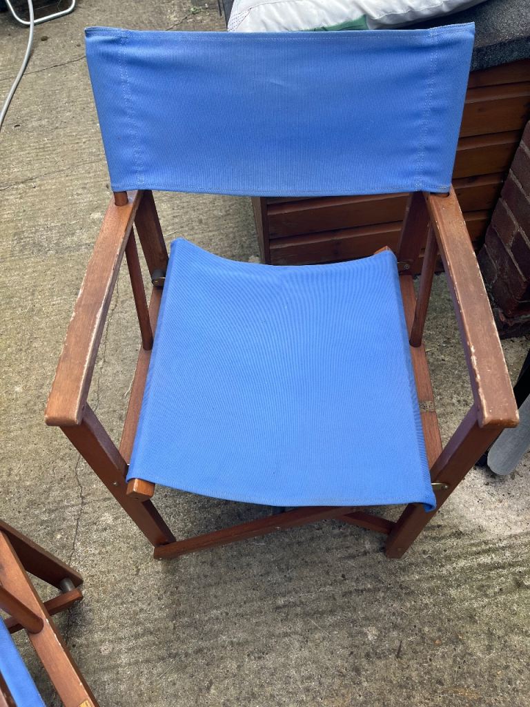 2 blue folding directors chairs 