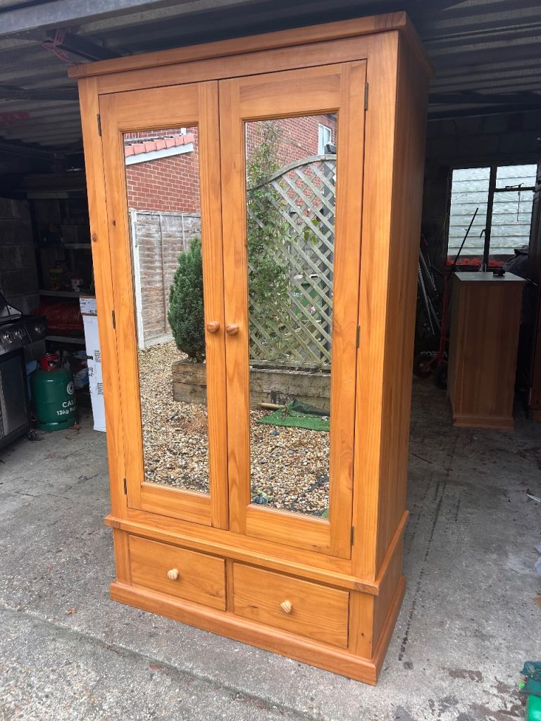 Lovely pine mirrored wardrobe with drawers. Possible delivery 