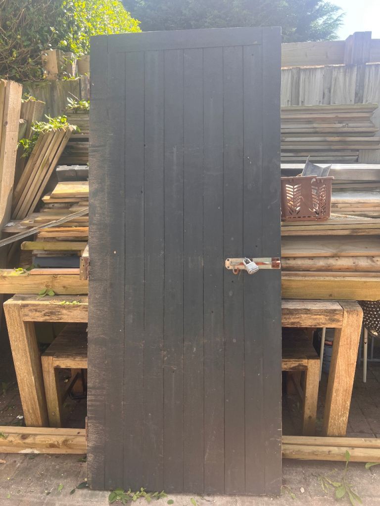 Solid wooden garage/outhouse door. 