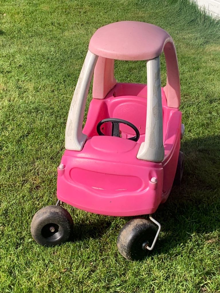Little tykes sit in car 