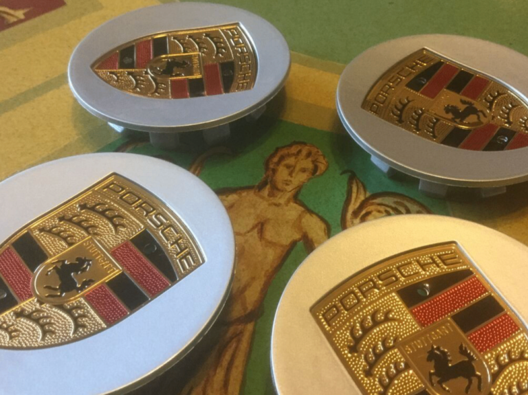 PORSCHE SILVER WHEEL CENTRE CAPS SET OF 4 BRAND NEW