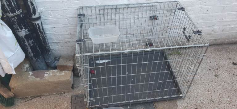 Dog cage, medium sized, used but in good, clean condition.