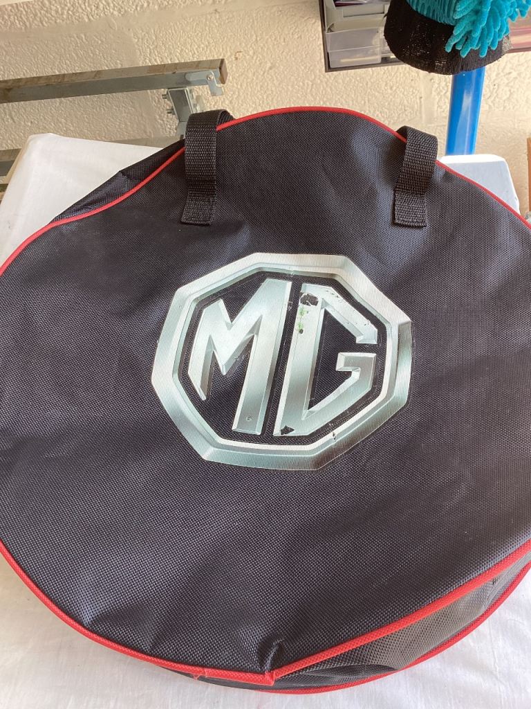 Electric car charging cable with storage v bag
