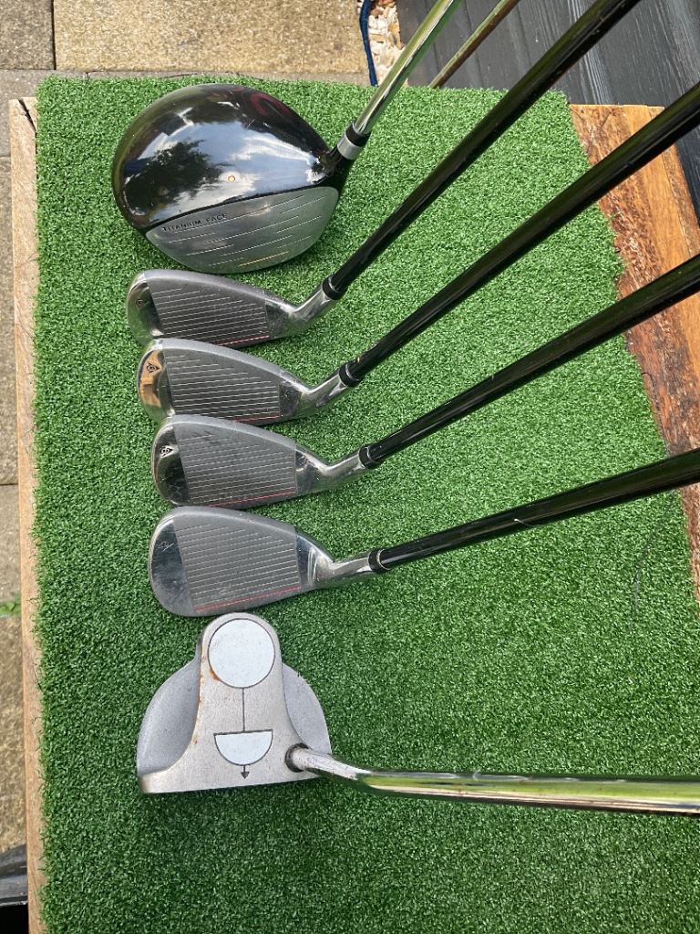 Irons, driver, putter, bag, golf balls tees
