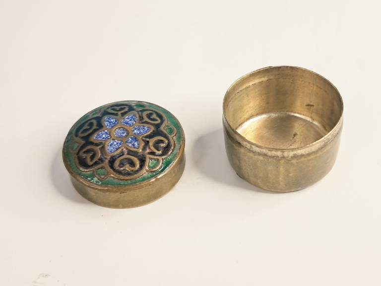 Vintage miniature trinket or pill box enamel floral designs on a brass base. 