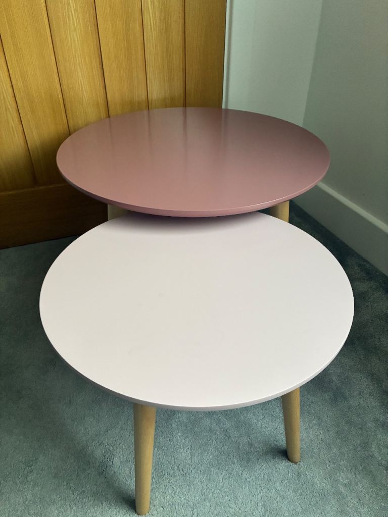 Set of two pink circular tables