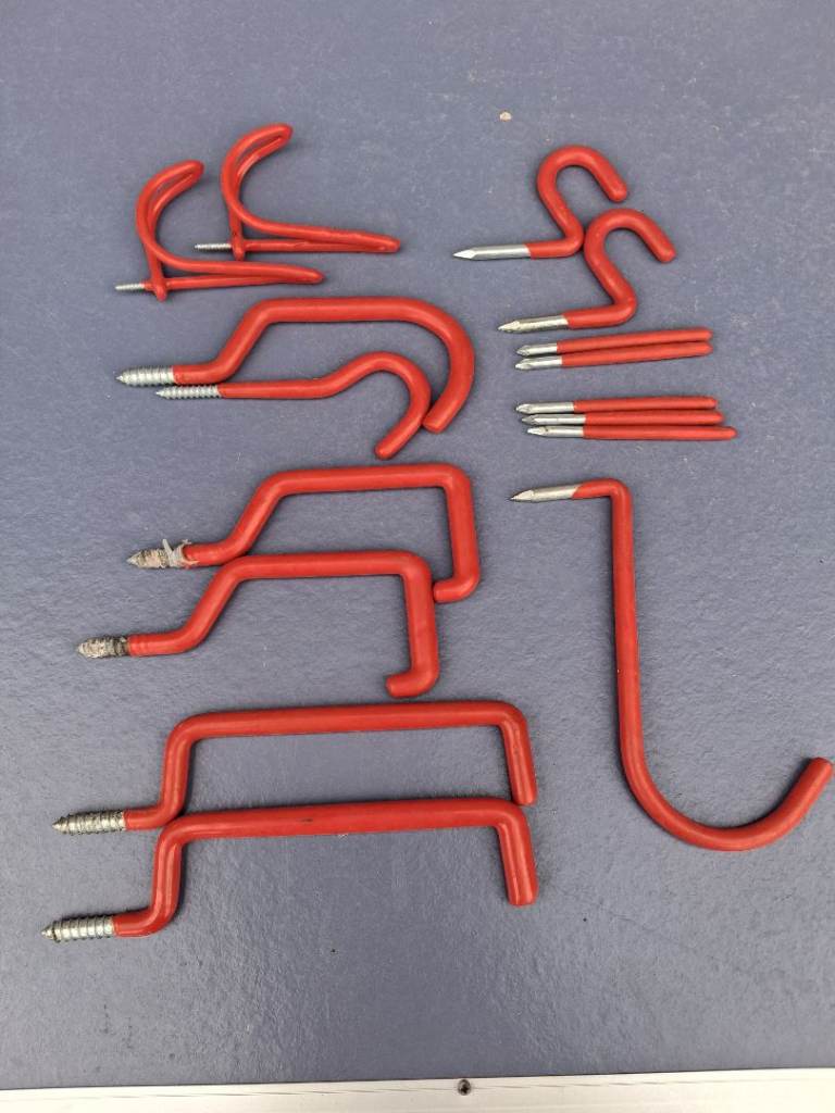 Red Metal Tool Hooks for Garage or Shed Storage
